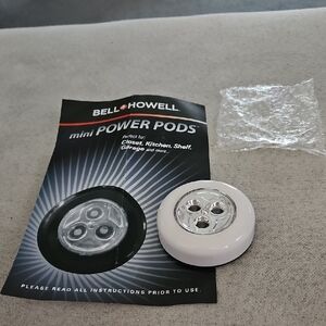Set of 9 White Mini Power Pod LED Tap Lights.